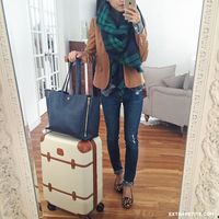 Casual + comfortable travel outfit - skinny jeans, neutral blazer, plaid blanket scarf, navy tote, carry on luggage, leopard flats