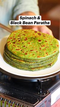 Try this easy Spinach and Black Bean Paratha. This Indian flatbread has a green spinach-enriched dough, a spicy black bean and cheese filling and 20g protein per serving! A delicious, wholesome breakfast, lunch or dinner. I enjoy mine with cottage cheese, red onion, chilli and Indian pickle.