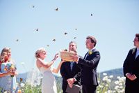 At the conclusion of the ceremony, Kristen and Tyler opened a basket to release three dozen monarch butterflies into the air. #weddingceremony #decor Photography: Meg Perotti. Read More: http://www.insideweddings.com/weddings/colorful-outdoor-wedding-at-northern-california-ranch-winery/444/