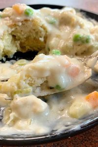 Creamy, savory, and comforting all describe this easy Chicken a la King recipe. A perfect combination of chicken, peas, carrots, celery, and onions in a creamy flavorful gravy. This easy dinner recipe is perfect served over biscuits like shown in my recipe or over rice or mashed potatoes. No matter how you serve it, it’s delicious and filling.