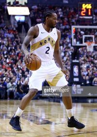 Kawhi Leonard of the Toronto Raptors dribbles the ball during the first half of an NBA game against the Portland Trail Blazers at Scotiabank Arena on...