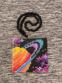 Glow in the dark space and planet design perler kandi necklace. Super cute and fun for festivals and other EDM events! Please message with any variations or customizations you might want to make. I'm happy to work with you to make it the perfect piece for you! Thank you for shopping at Byte Size Kandi!