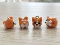 💛 Clasp / Keychain 💛 These Pembroke Welsh Corgi glass beads are cute and dainty, which is a perfect gift for kids, friends and dog mom.  It is made of the following: 🔹 Corgi (Size: H10 x W10 x D11mm) : It is handmade glass beads. Each bead is unique so there is a slightly different from bead to bead. 🔹 Clasp / Keychain: gold / silver plated over brass Lobster Clasp: W5mm x H10mm Ring Clasp: W8mm x H10mm (inner diameter 4.5mm approx.) Apple Keychain: W27 x H44mm Strawberry Keychain: W25 x H42