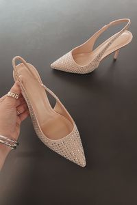 That's all you'll be hearing when you wear these stunning heels!! Nude colored rhinestone studded pointed toe sling back heels, skinny heel Runs true to size Heel height is