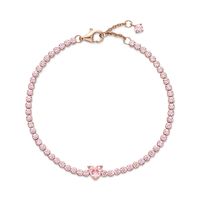 Bring elegance to your outfit with the Sparkling Pavé Tennis Bracelet. Hand-finished in a 14K rose gold-plated unique metal blend, this tennis bracelet is decorated with sparkling orchid pink man-made crystals. A large central heart-shaped stone punctuates a row of evenly sized pavé. The bracelet includes a lobster clasp for safe closure and can be adjusted to three lengths. Style it with other shimmering Pandora Timeless pieces for a classic look that stands out.