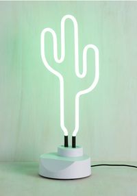 This neon cactus light. | 24 Unexpected Ways To Add Greenery To Your Home