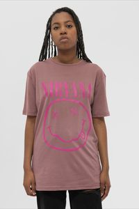 An official licensed Nirvana Unisex T-Shirt featuring the 'Purple Smiley' design motif. This high quality T-Shirt is available in a dusky pink colourway. Classic fit soft-style cotton tee with short sleeves and crew neck. Features front printing. Comes in a wide range of sizes from Small through XX-Large, subject to availability.