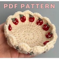 This crochet trinket dish pattern is perfect for adding character to your room! It can be be displayed with the strawberries facing inward out outward. You can customize it with your favorite color combinations if desired. The pattern instructions and pictures make this perfect for any beginner or crochet expert. This is perfect to make for yourself or any loved one! The pattern is written in US terminology (English only) and is available for download instantly after purchase through your Etsy account. This is NOT a listing to purchase a completed dish. If you would like to purchase the physical item please see my listing: https://www.etsy.com/listing/1742460887/crochet-strawberry-trinket-dish