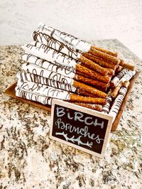 Cute woodland baby shower food or take home gift! These birch branch pretzel rods are an easy take home favor or treat to make for a woodland inspired baby shower!