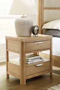 This nightstand's classic yet contemporary good looks are hard to deny. Softly shaped posts with a light oak finish and wire-brushed wood grain texture lend an organic appeal to your soothing space. The open stacked shelf design makes for a trend-right and functional bedside option. An integrated power outlet and USB charging ports keep your devices powered up. Ashley® is a Registered Trademark of Ashley Furniture Industries, LLC.