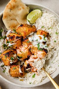 Tandoori Salmon Rice Bowls are boldly flavored, quick-to-make, and completely delicious. The salmon marinates in warm spices and Greek yogurt.