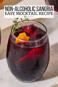 Non alcoholic sangria recipe with a spiced hibiscus syrup, fresh citrus, and thyme. This delicious sangria mocktail recipe is perfect for serving a crowd!