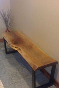 We built this rustic walnut bench for a customer and love how it looks in its new home.  Walnut is a beautiful, durable hardwood that will stand up to wear and tear and keep looking great! The live edge gives it a one-of-a-kind uniqueness.  See how we can custom build a bench for you.