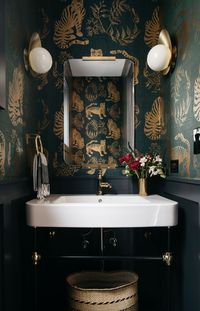 Dramatic Bathroom Design by Leah Phillips Interiors:  Dark and Moody Powder Room Re-do, Tiger Wall Paper, Modern Brass Sconces, Brass Hardware,  modern wainscot, cement tile,  white ceramic sink console, Painted wainscoting with Soot by Benjamin Moore, Chicago bathroom design, Chicago interior design, Chicago Interior Designer, bathroom design, moody bathroom, powder room design, dramatic bathroom