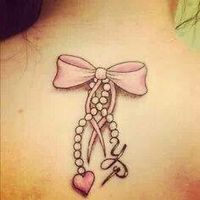 Love this bow tattoo