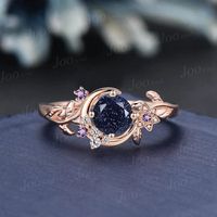 Nature Inspired Round Galaxy Blue Sandstone Amethyst Wedding Ring Unique Moon Leaf Vine Blue Goldstone Engagement Ring Art Deco Promise Ring Engagement Ring: round cut alexandrite The side stones are amethyst and moissanite Material Metal: 925 sterling silver, Solid 10k/14k/18k gold,platinum This jewelry is made to order, it can be made with any gemstone/metals. 2-3 weeks to finish. Default Shipping method is usps. 30 days non-hassle return policy.For returned items,there may be handcrafting and