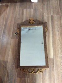 Offered for sale is this stunning wood and gilt mirror with original label.