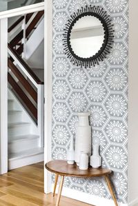 Hexagonal tile effect wallpaper pattern, with a central stylised flower motif.