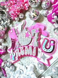 "Complete your little gal's event with this luxuriously layered glitter shaker cake topper!! The name is cut from glitter silver cardstock. Disco ball and age are cut from silver glitter cardstock.  Other embellisgments are cut from multiple shades of matte & foil pink cardstock. The boot and hat are embossed with a southwest pattern for extra detail. Prefer different colors? No problem!! Size: 8 \" wide x 7\" tall. No names longer than 8 letters. Need a matching birthday banner or cupcake toppe