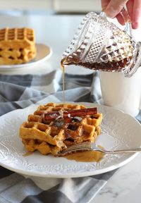 Crazy for pumpkin? Make these gluten-free pumpkin waffles with spiced maple syrup. Crispy on the outside with just the right amount of pumpkin spice. Perfect for fall mornings or holiday breakfasts. Get the recipe on the blog! Pumpkin Spice Maple Syrup - Pumpkin Spice Waffle Recipe