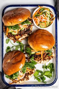 Take your sandwich game to the next level with a Korean twist, with this flavor-packed Korean pulled pork sandwich. Slather some creamy, tangy kimchi mayo on buttery brioche, then load it up with tender pork slow-cooked to perfection in flavorful gochujang. Topped it off with pickled veggies and vibrant herbs - it's perfect for when you're craving something hearty yet fresh! #theendlessmeal #pulledporksandwich #pulledpork #sandwich #koreansandwich #koreanpork