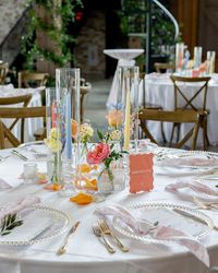 you kidding me 🥲 these pastel tapers added so much to this tablescape!! A sweet bud quartet paired with a trio of taper candles is one of our favorite ways to add a little something something to a guest table. here, we opted for mini centerpieces on some of our farm tables + invested in smilax vines to give life to the venue overall - which is something ALL your guests can enjoy, no matter which table they’re sat at. It’s all about creating an atmosphere! Planning @perfectlyplannedtx Venue...