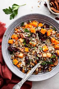 Cranberry pecan sweet potato wild rice pilaf is a perfect fall side dish infused with incredible flavors and textures. Crunchy pecans, cranberries, sweet potato, wild rice, and herbs come together in this tasty dish!