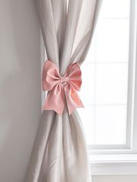 Bow Curtain Tie Back Unique Bow Curtain Tie Backs Looking for a unique way to tie back your curtains? Add a bow to your curtain panels! Why just tie your curtain panels back when you can tie them back with a large, perfect bow? No Bow-tying skills required! These pretty bows come sewn into the perfect bow you see here simply tie the ribbon around your curtain panel to hold it into place. Includes: TWO 10-11" 3D Premium/Wool Felt Blend Bow Tie Style Curtain Tie Backs Long 7/8" Grosgrain Ribbon is