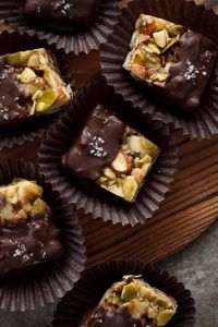 Make these delicious, bite-sized chocolate nut squares easily at home using your favorite nuts, seeds and chocolate for dipping.