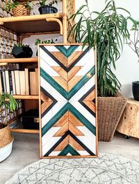 "AZTEC wood wall art with unique geometric patterns. Turquoise color with epoxy resin DIMENSIONS: AZTEC CENTER PIECE: Height : 33\"\" (82 cm) Width: 17 \"\" (42cm) Diamond: (1x AZTEC black/ 1x AZTEC white) Height: 23 \"(59 cm) Width: 13 \"(34 cm) Triangle: (1x SUN black, 1x SUN white) Height: 12 \"(30 cm) Width: 13 \"(34 cm) Thickness: 0.78 \"(2 cm) Made from wood, locally sourced. Custom sizing is available by request. Hanging hardware is included on the backs of each piece. Each piece is caref