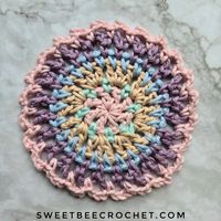 The Morning Mini Mandala has received a refresh! New photos, an updated layout, and made with worsted cotton instead of DK weight yarn. These little projects measure approximately 4 1/2 inches in diameter and can be used as coasters, bunting, or mounted in an embroidery hoop for some cute home decor. I used 5 shades of @wecrochetofficial Dishie for my versions and each round uses such a small amount of yardage that it's perfect for stash busting. The free pattern can be found at sweetbeecr...