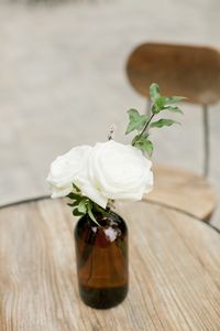 White flowers in amber bud vases