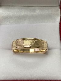 10K SOLID YELLOW GOLD WEDDING BAND      Width: 5mm            Finish: Hammered Finish       Fit: Comfort Fit Size: 4-12       Available in White,Yellow or Rose Gold  and  10K -14K - 18K - Platinum - Also Available Different Widths, Colors and Finishing. Manufactured in New York, USA. -Please let us know your exact size after ordering. All rings are available in full, half or quarter sizes.  -All of our jewelry is Solid Gold. We do not sell Filled, Hollow or Plated Jewelry.   -We offer Free Engraving, Free Re-Sizing & Free Re-Finishing.   -Finishing Options are: Hammered, Brushed, Satin or Shiny.   -Engraving Fonts are: Arial, Script, Roman, Block or Contempo.   -Complimentary Jewelry Gift Box.     Payment Policy   Paypal Confirmed Addresses Only     Shipping Policy   Attention Internationa