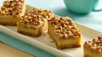 Enjoy cheesecake in the form of an easy bar with layers of caramel, rich toffee and crunchy nuts.