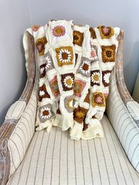 Beautiful handmaid crocheted floral blanket! Made of cream, pink, rust, orange, coral and grey color with a matching soft white minky backing with a ruffled edge. This traditional granny square blanket is the perfect gift and addition to any home. Decorate your bedroom, living room, or couch with this unique throw. Perfect baby shower gift as an heirloom blanket. Large size perfect for adults. Extremely soft, warm and weighed blanket, lovingly made for those winter months!  Measurements: Width: