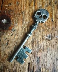 "This custom designed skeleton key (sometimes called a master key) with a skull-shaped bow is made stainless steel and aged ebony wax to give it depth and character. Great for costumes, gifts, and decoration. My copy was designed as a prop for a Caribbean pirate themed family \"staycation\" adventure. NOTE: My shop's prices now include Etsy's recently increased seller fees. Thank you for understanding."