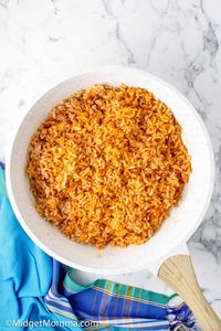 If you are looking for the BEST Mexican Rice Recipe this is it! This Mexican rice recipe tastes JUST like the Mexican rice that you get at a restaurant and it is so easy to make! This authentic Mexican rice is perfect for pairing with many Mexican main dish recipes and makes the perfect side dish for a Mexican Meal.