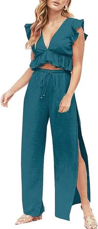 Elevate your style with the FANCYINN Women's 2 Pieces Outfits featuring a Deep V Neck Crop Top and Side Slit Drawstring Wide Leg Pants! ✨👚👖 This chic and versatile jumpsuit set is perfect for any occasion. Embrace the fashion-forward design and make a statement with this trendy outfit. #FANCYINN #CropTopAndPantsSet #JumpsuitFashion