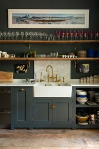 A Carrara marble sink, Classic English cabinets, a beautiful double Belfast sink and an aged brass Ionian tap, made in collaboration with Perrin and Rowe, is a wonderful combination. The two long open shelves provide the perfect spot to display the customer's lovely collection of glassware and crockery and the thin painting above reminds us that this is is more than a kitchen, it's a place to spend time in and enjoy together.