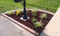 Mailbox Flowerbed: 18 Stone blocks, 21 Capstones, variegated lariope, Asiatic lilies (tiny series), and lava rocks.  The stone blocks and capstones were purchased from Lowes (Allen & Roth brand). The lily names are (l to r) tiny bee, tiny padhye, tiny sensation, and tiny spider.