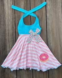 This cute custom boutique donut dress would be perfect for a donut themed birthday party or just a fun day out in the sun. Top bodice is aqua, skirt panel is pink white stripe with a sprinkle donut on front. Check out are donut theme section for a variety of outfits and dresses for little girls.