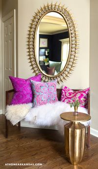 At Home in Arkansas | January/February 2015 | Elements of Style The home’s foyer welcomes the family home with a “Wellington” mirror and “Flirt” side table. The pillows are made from vintage scarfs and saris from Childers’s travels. @nancynolan @emporiumhome