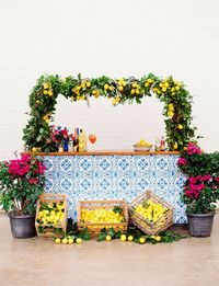 Colorful Southern Italian Wedding with DIY tile bar sticky tiles and limencello lemon floral greenery backdrop