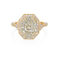 A spectacular 18 karat yellow gold octagonal engagement ring mounting set with a diamond halo and trefoils of diamonds nestled on each side. With a lovely floral diamond motif found under the basket setting. A total of .54 carats. A Tiny Jewel Box Roslyn Collection original, to be finished with a center stone of your …