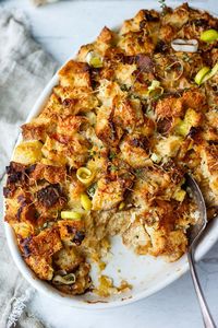 This Savory Bread Pudding with leeks and gruyere is as cozy as it gets!  A delicious and comforting side dish or vegetarian main- perfect for special dinners or the holiday table. (Adapted from Thomas Keller's recipe- but a little lighter!)