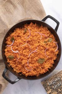 Try this delicious, vegetarian Nigerian jollof rice - one-pot stewed tomato and pepper rice with a crispy bottom.