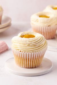 The mango cupcakes feature a delicate vanilla cupcake, filled with a homemade mango filling and topped with a whipped cream cheese frosting.