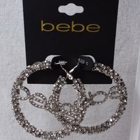 Hoop Pierce Earrings In Silver Tone With Clear Rhinestones With Logo Bebe By Bebe. New Without Tags. Did Not Removed From Card For Pictures. Measurements 2 Inches By 2 Inches. Measurements Done Laying Down Are Estimated. # A-I-24