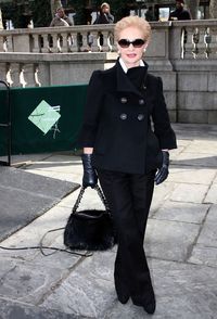 Carolina Herrera looked fetching in a bell-sleeved black pea coat on day 4 of NY Fashion Week.