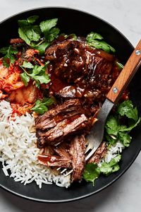 We’re adding ginger, gochujang paste, and soy sauce for the most flavorful slow cooked pot roast. Serve it with fluffy white rice, steamed broccoli, and Korean style wings for a tasty meal.